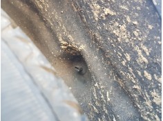 PLASTICO PASE RUEDA TRAS. IZQ. 767492968R 