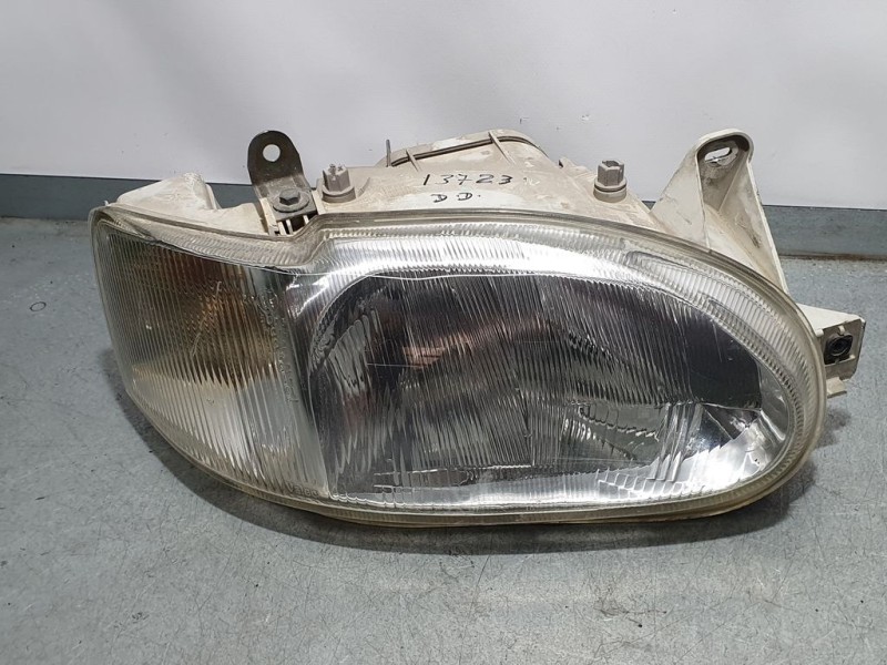 Recambio de faro derecho para ford escort berl./turnier ghia berlina referencia OEM IAM 1076554  ROZADO