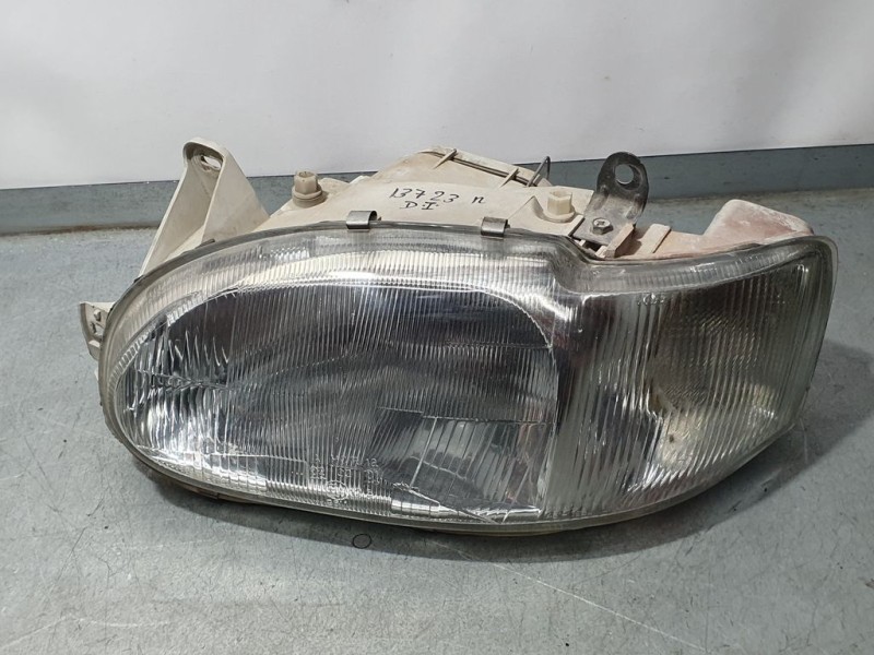 Recambio de faro izquierdo para ford escort berl./turnier ghia berlina referencia OEM IAM 1076561  PATA ROTA