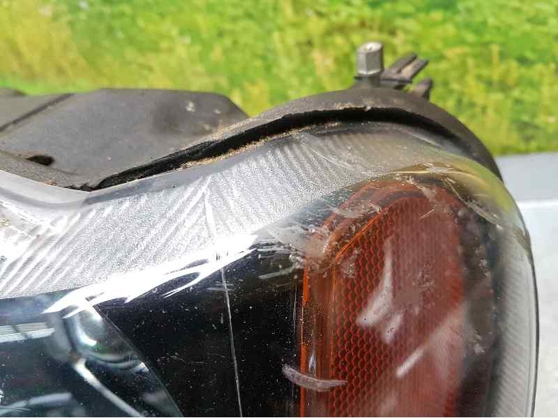 Recambio de faro izquierdo para jeep gr.cherokee (wj/wg) 2.7 crd limited referencia OEM IAM   LLEVA UNA GRIETA POR DETRAS