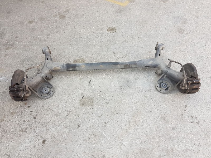 Recambio de puente trasero para kia rio iii (ub) 1.2 cvvt referencia OEM IAM 551001W610 DISCO C/ABS Y 4 TORNILLOS 