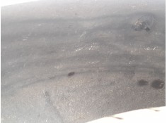 PLASTICO PASE RUEDA TRAS. IZQ. 767497372R 